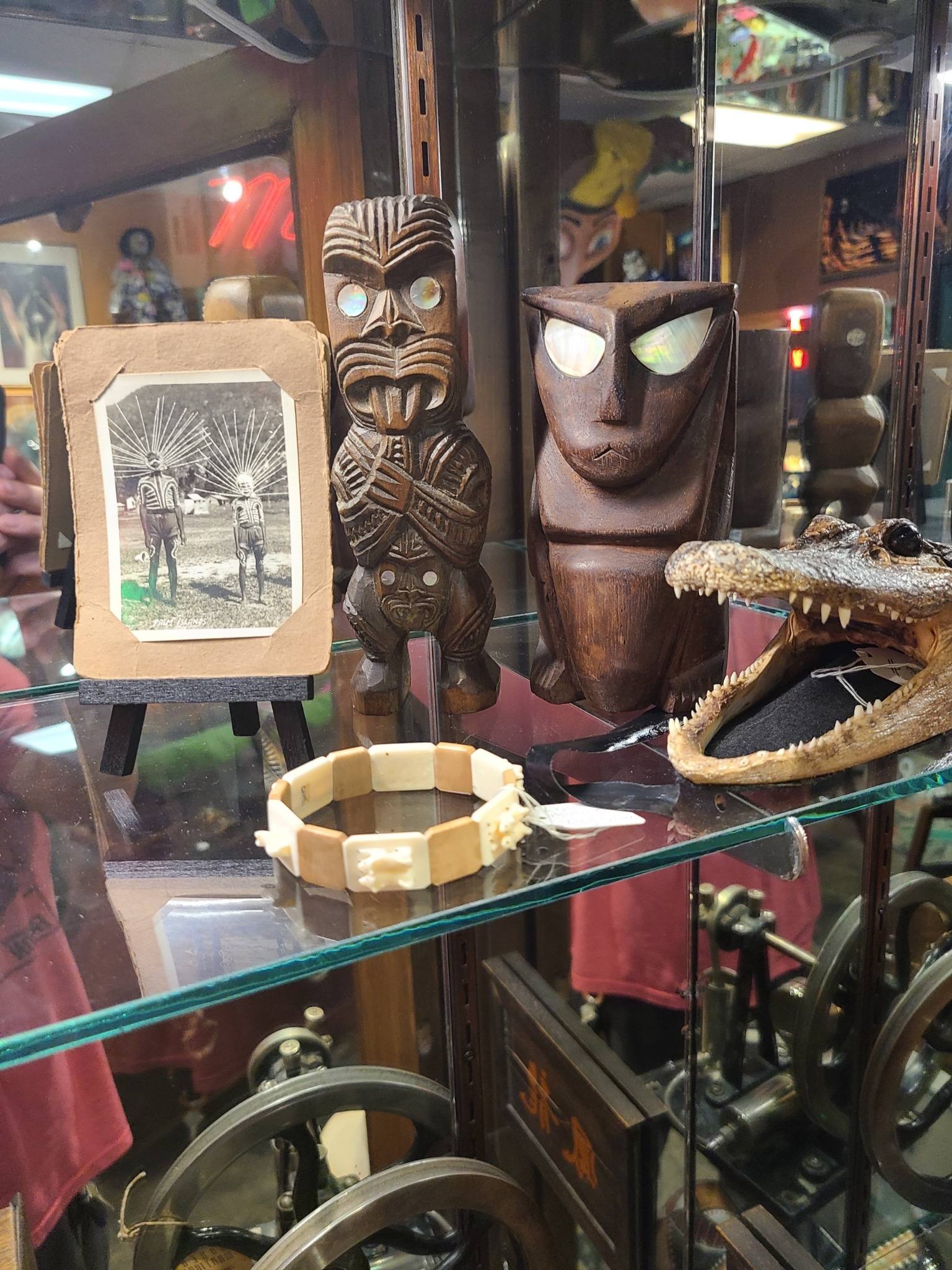 Tiki tribal curiosities collection Polynesian artifacts Maori tiki figure antique collectibles Las Vegas